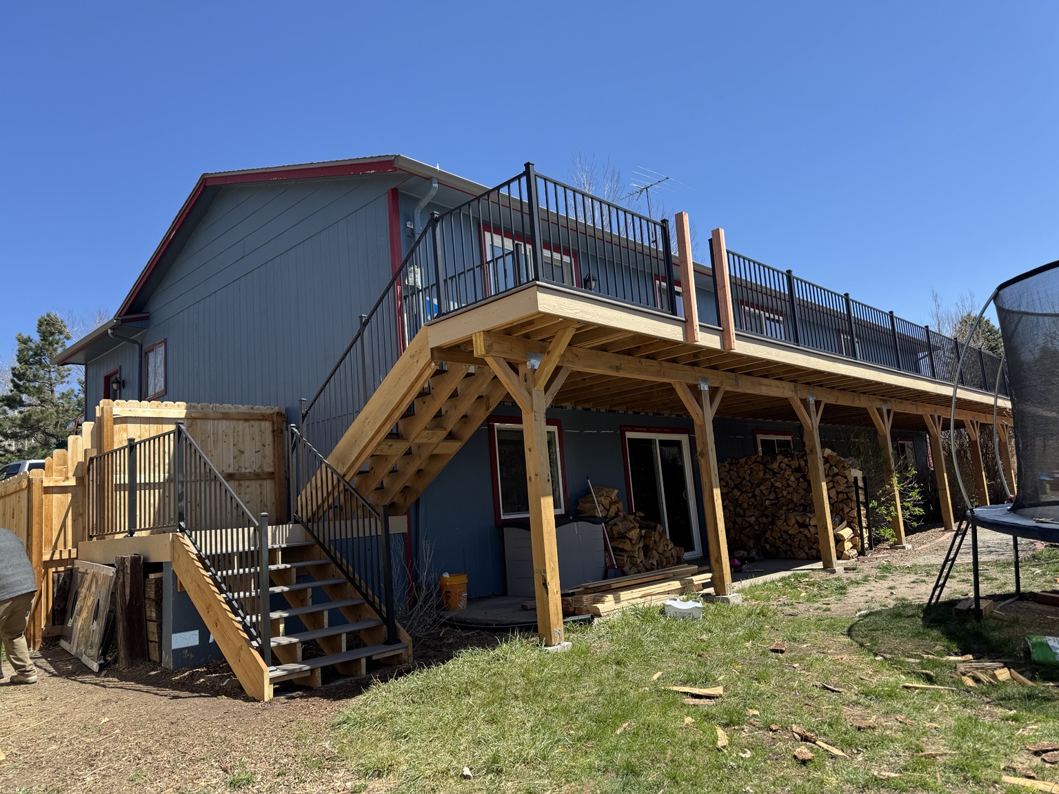 Long elevated deck with black metal railings